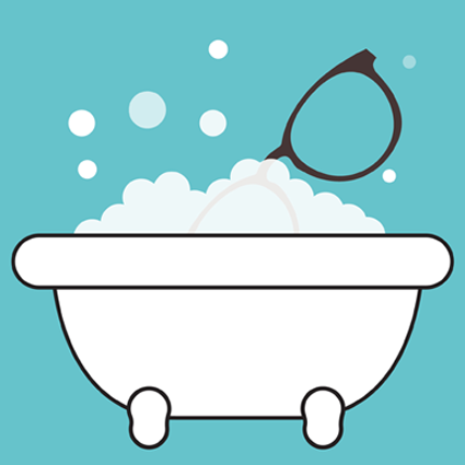 Bathtub filled with bubbles and a pair of glasses resting on top.