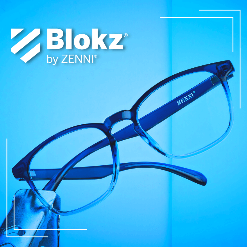 Blokz by Zenni. Blue light filtering glasses held by a hand against a blue background.